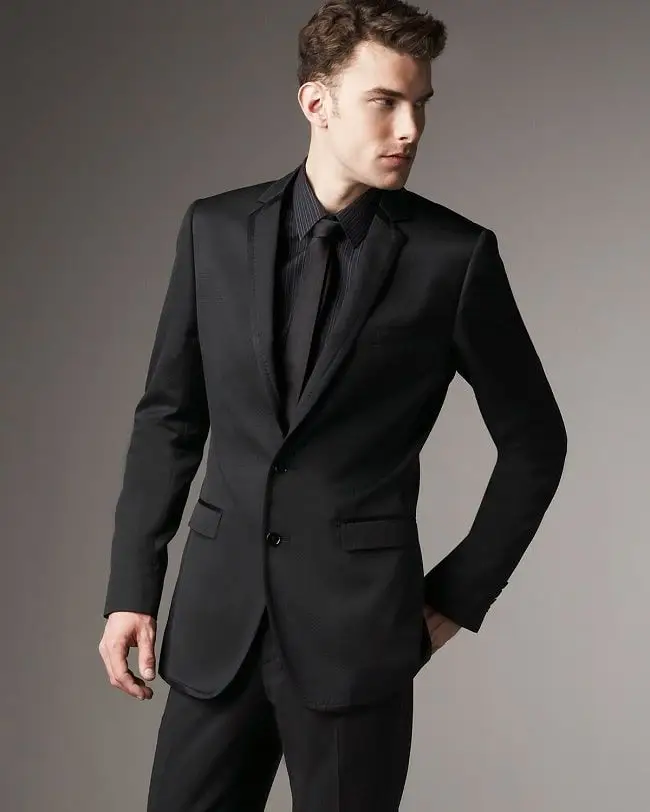 An all-black look with a black suit and loafers is sleek and modern, perfect for a stylish, bold, and sophisticated appearance.






