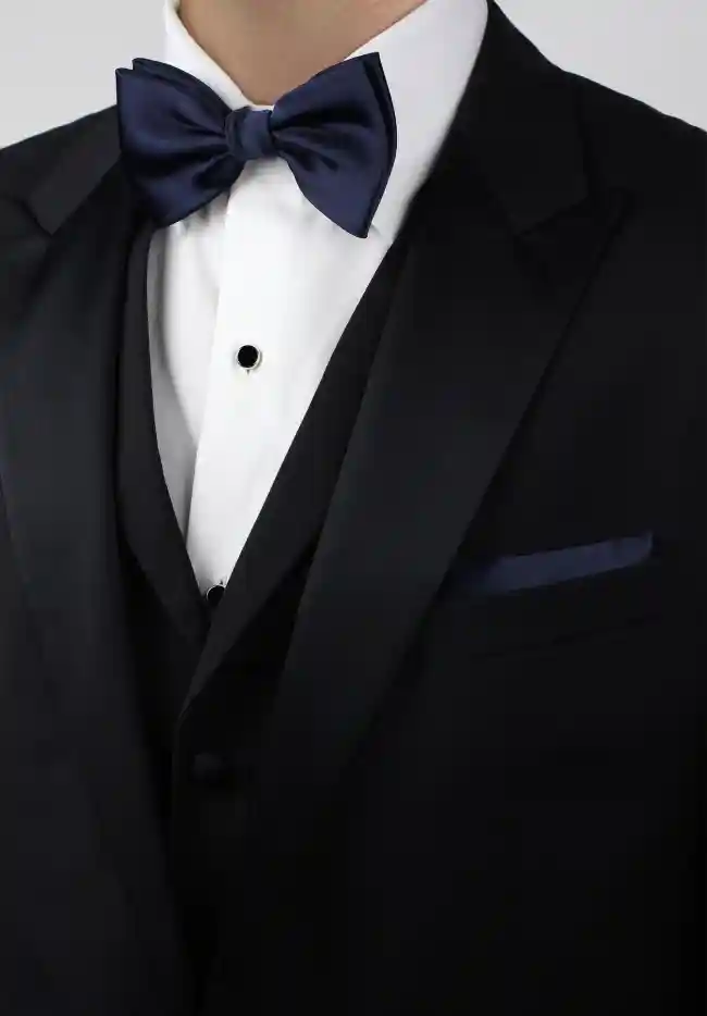 black suit with a blue bow tie